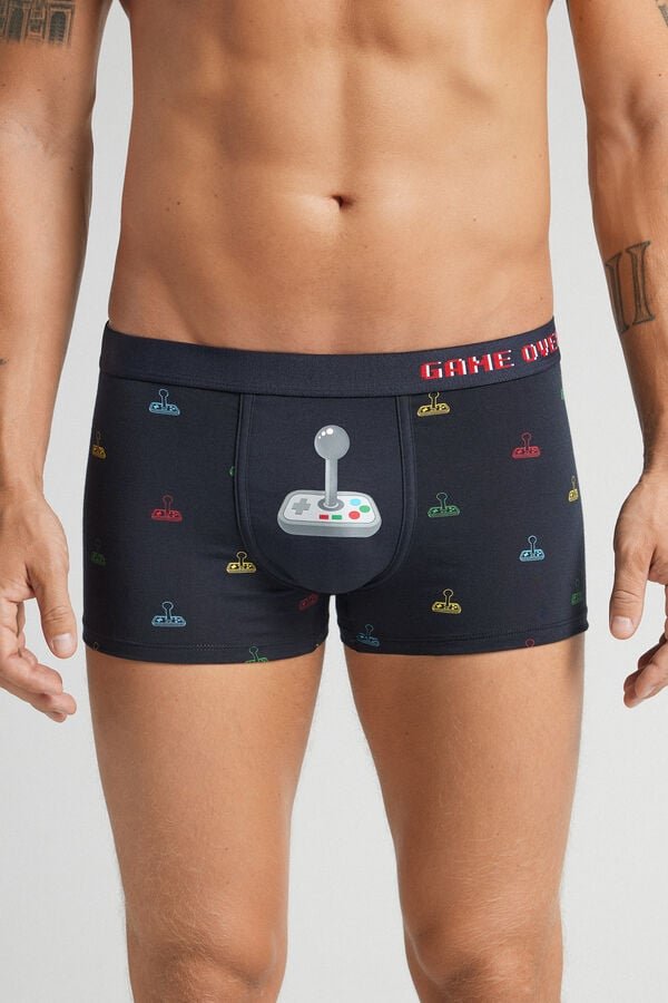 Black mid-length men’s boxers with all-over joystick print and exposed elastic waistband with Game Over text